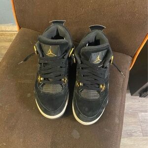 Black and Gold Jordan 4s